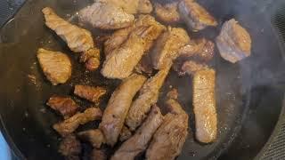 frying steak in a cast iron skillet