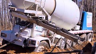 Truck got stuck in mud! Heavy equipment is working at the limit of its capabilities.