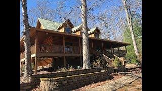 Beautiful Log cabin with detached garage and room above the garage