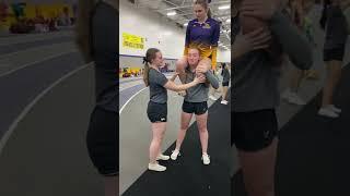 point cheerleaders and a shoulder sit spinnoff dismount