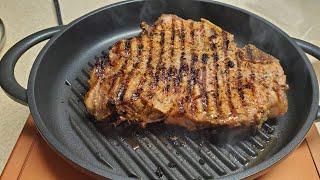 T-Bone Steak on The Whatever Pan Cast Aluminum Griddle with Glass Lid Copper Chef Induction Burner