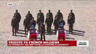 Tribute to French soldiers: coffins are taken away as band sings