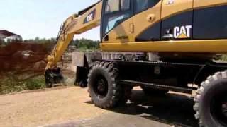 Cat® Wheel Excavators with Attachments in Action