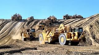 Glimpse at one of history's largest scraper mass grading projects. Caterpillar 657E 657G 651B