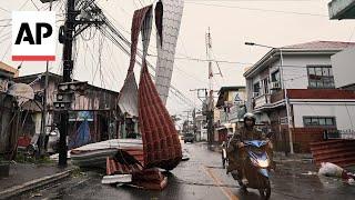 Typhoon Man-yi blows off roofs and brings flooding to the Philippines