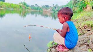 Little boy hunting big fish by rod ~ Traditional hook fishing in the river