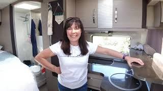 The Slaws arriving at a campsite and setting up the Motorhome