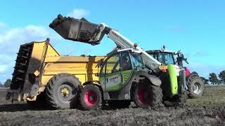 Older tractors and combines in operation.