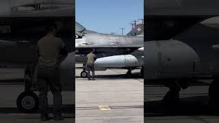 706th Aggressor Squadron pilot completes his walkaround of the F-16