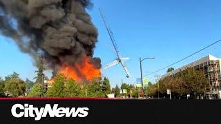 Crane falls as Vancouver firefighters battle blaze