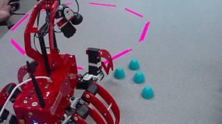 Chiara robot pushing plastic toys