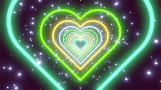 NEON TUNNEL OF COLORFUL HEARTS. Dark background in the form of a neon heart. Video Loop