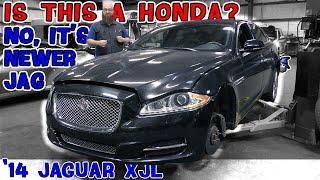 Not another boring car! This '14 Jaguar XJL is anything but boring. CAR WIZARD is very surprised