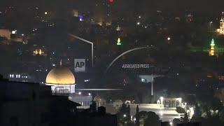 Missiles believed from Iran seen over Jerusalem as explosions overheard in other parts of Israel