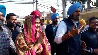 SAD leader Bikram Singh Majithia along with his wife Ganieve Kaur casts vote in Majitha