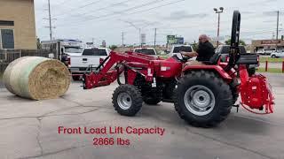 Mahindra 4540 Lifting a Round Bale