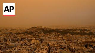 Athens, Greece, skies turn orange with dust clouds from North Africa