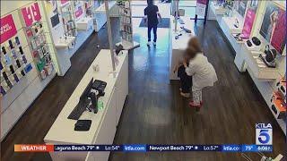 T-Mobile employee and alleged armed robbery suspect tussle at Seal Beach store