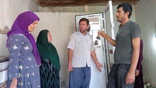 Bathroom door installation. And tiling the bathroom floor with the help of the son-in-law