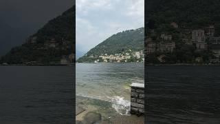 On the shore of the beautiful Lake Como overlooking the city of Como in Italy 2023