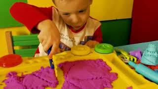 Danila Master plays with kinetic sand