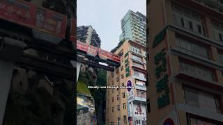 This train goes through a building!  Liziba Station in Chongqing, China