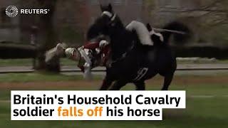 Britain's Household Cavalry soldier falls off his horse