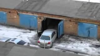 A woman tries to enter the garage door