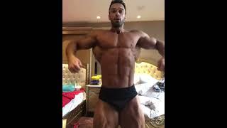 Bulky Vahid Nazari flexng his rock hard muscles.