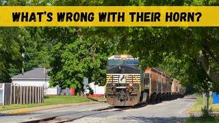 What's seems to be WRONG with their HORN???  as the train runs down the street-run!!!
