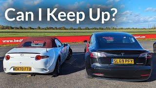 Chasing a Tesla Model 3 Performance in a standard MX5 on Track.