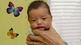 How To Calm A Crying Baby - Dr. Robert Hamilton Demonstrates The Hold (Official)