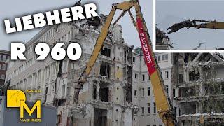 Liebherr R960 high reach excavator ripping down historical building downtown