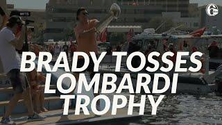 Tom Brady tosses Lombardi Trophy to another boat during Super Bowl boat parade