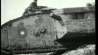 Mark I tank moves over a trench as soldiers sit on it during Battle of Arras in W...HD Stock Footage