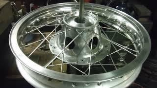 BSA / Triumph conical rear wheel build discussed and poor front wheel build highlighted.