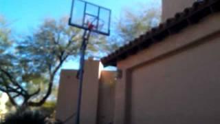 5'10 dunking on 10 foot and a quarter hoop, concrete