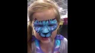 Erin's tiger face-painting roar with Michael Mejia uncoverbodyart