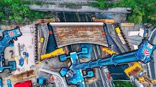 truck crane raises bridge | Munich, Germany