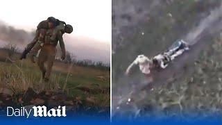 Two hero Ukraine soldiers save their wounded comrades by carrying them across Bakhmut battlefields