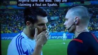 Bosnian player Emir Spahic + linesman covering mouths when talking on sidelines