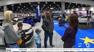 10News anchor Marie Coronel speaks to San Diego Auto Show attendees