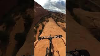MTBer rides down a cliff with no climbing gear