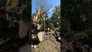 Setting a Giant Granite Boulder that was found in the forest on the edge of our customers property!!