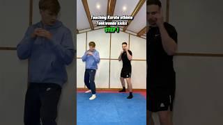 Teaching karate athlete Taekwondo kicks