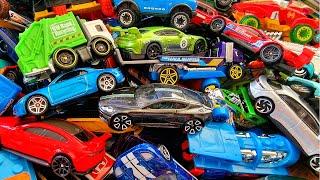 Miniature cars collection piled up in a plastic box *