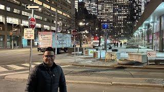 Fintech Nights: Exploring Wellington Street's Evening Charm Near the Iconic CN Tower, Toronto.