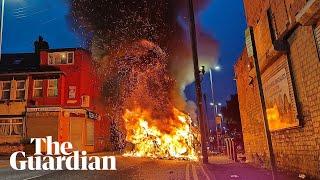 Police car turned over and vehicles set alight in Leeds unrest