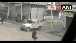 Protestors throw stones at security force's vehicles after Shopian encounter