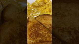 Breakfast for my kids. Grilled cheese and cheesy scrambled eggs with toast.